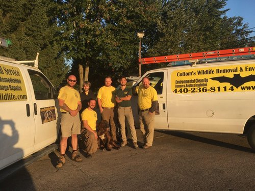 6 Wildlife Removal, Trapping And Prevention Experts Posing In The Parking Lot At The CWR Northern Ohio Office In Cleveland