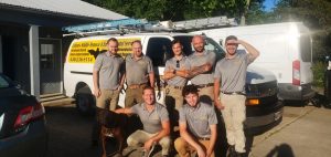 June 30 2021 - Pictured Here Are 7 Specially Trained Bat Removal Professionals From The CWR Bat Removal Service Of Ohio - Back Row, From Left To Right Are Mike Cottom Jr, Mike Cottom Sr, Alex Svensen, Jason Neitenbach and Nathan Lang. Front Row, From Left To Right Are CRW's mascot dog Hendrix, Tyler Phillips and Kyle Fortune. These professional, licensed and certified bat control experts provide humane bat removal services to Ohio homeowners and Ohio businesses that safely solve bat problems, exclude bats from attics, eliminate bat infestations and get rid of bats in attics and walls that have become pests.